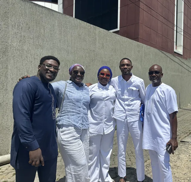 A group photograph outside the venue