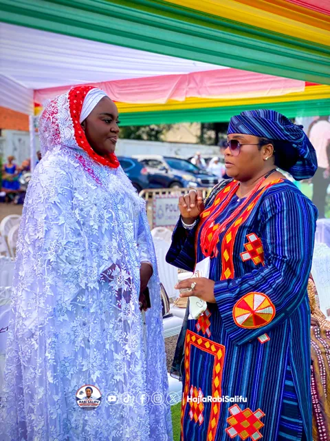 A conversation beneath the event canopy